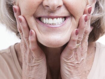 Older women happy with her dentures