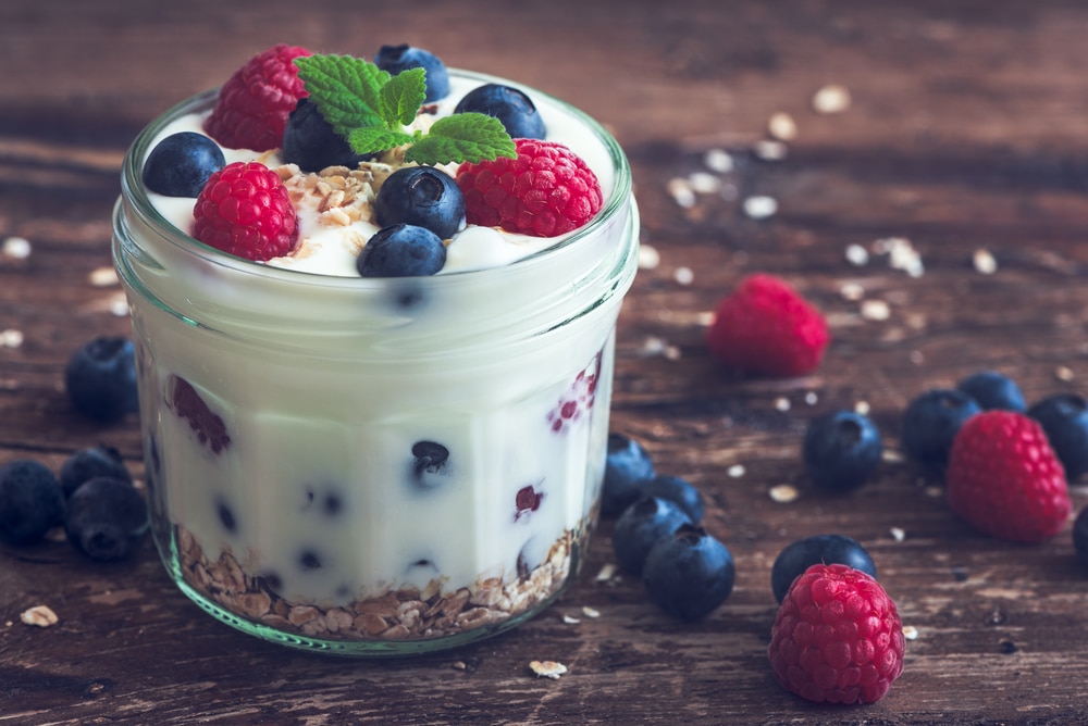 Soft food like Yogurt with Whole Fresh Blueberries, Raspberries is helpful after dental surgery