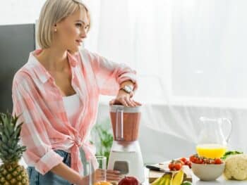 woman making smoothies after dietary advice